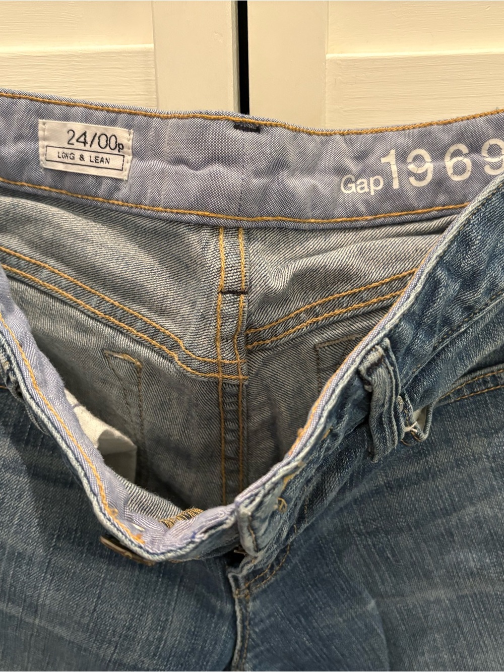 VINTAGE GAP Women's Boot Cut Jeans in Light Blue Denim.
